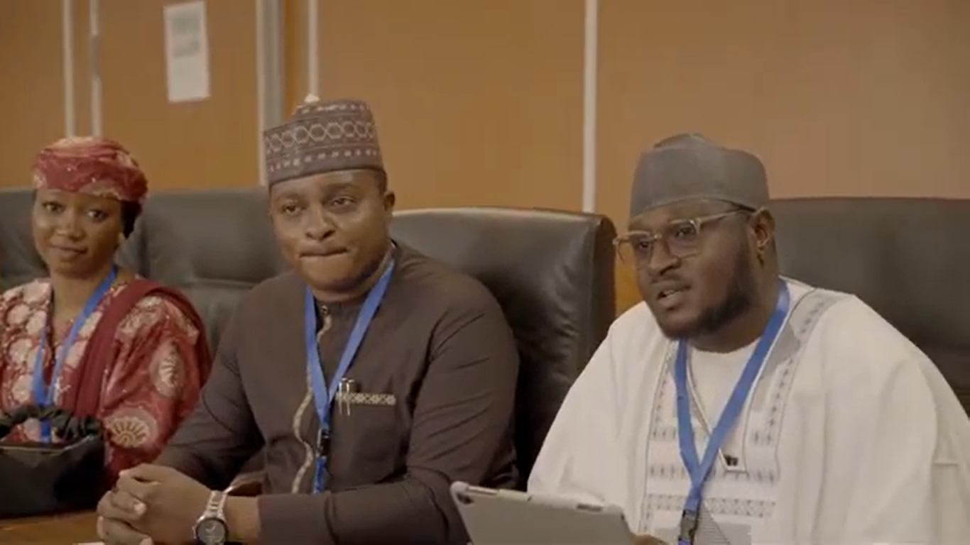 Three FoRB’s Future participants seated together at a conference table.